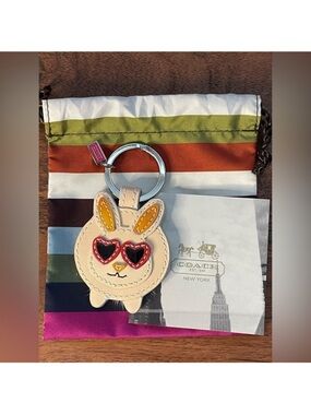 COACH Patent Sunglass Bunny
Bag Charm w/Mink Tail & Striped
Dustbag
